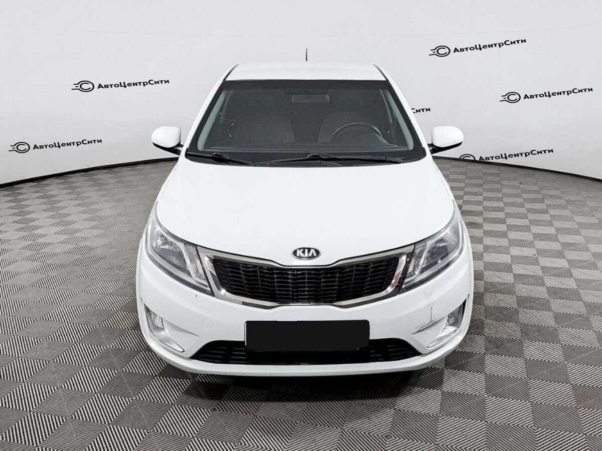 Kia Rio с пробегом — 2013 год. Фото: #1