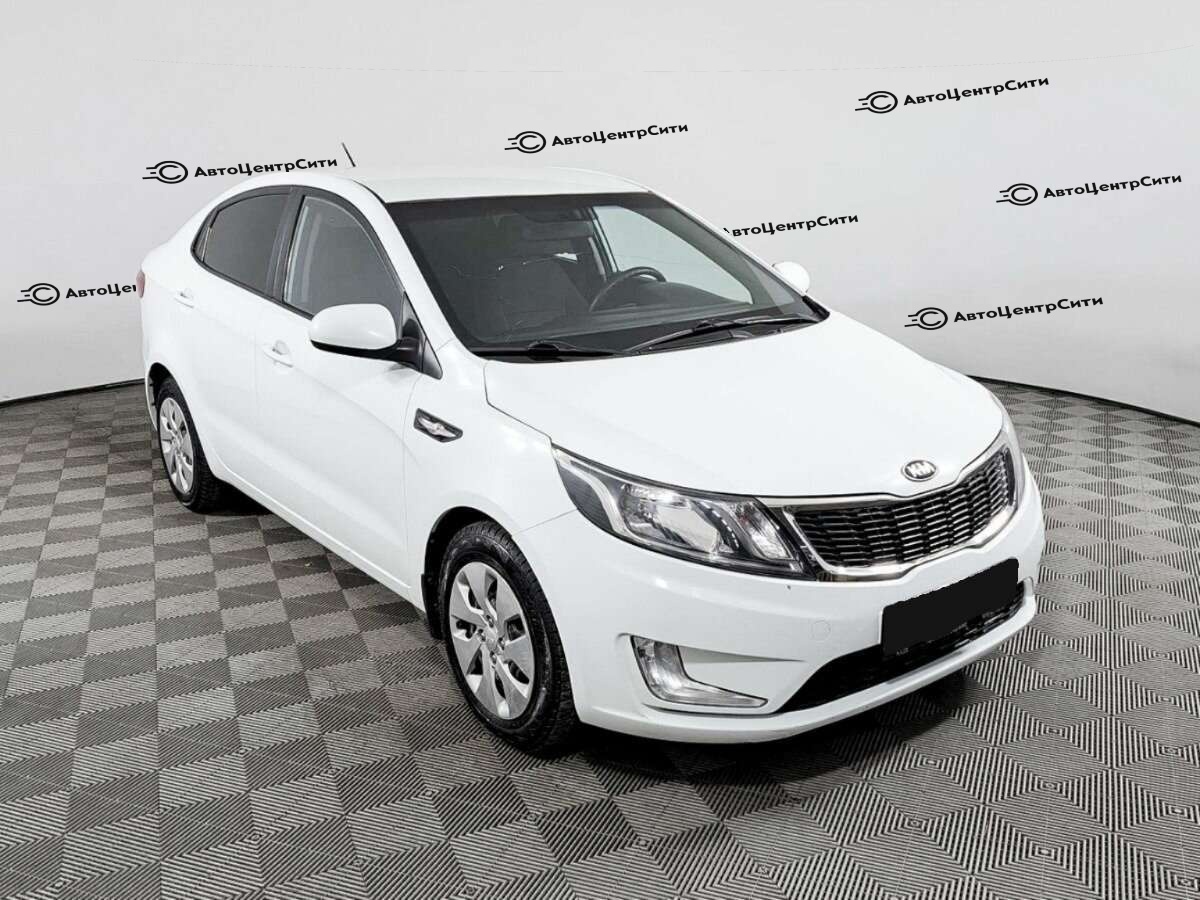Kia Rio с пробегом — 2013 год. Фото: #2