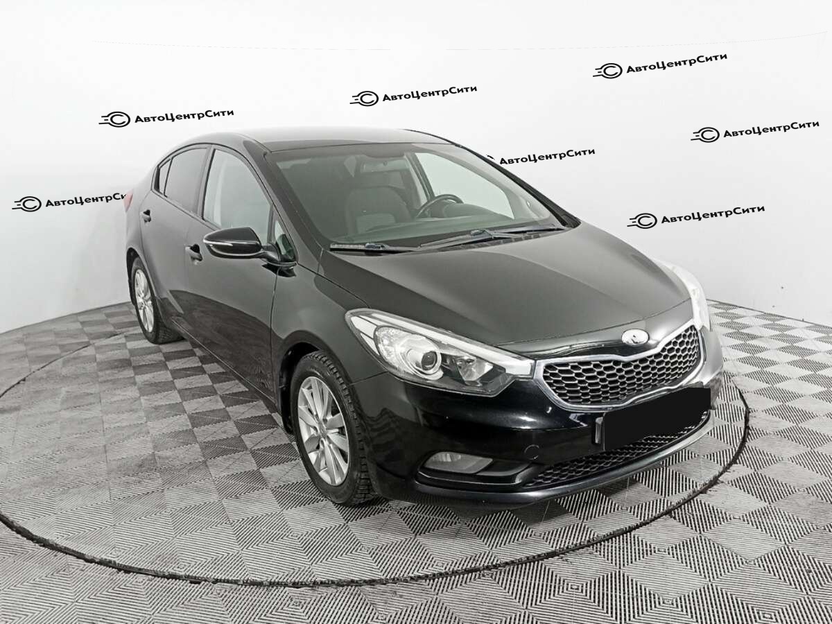 Kia Cerato с пробегом — 2013 год. Фото: #2