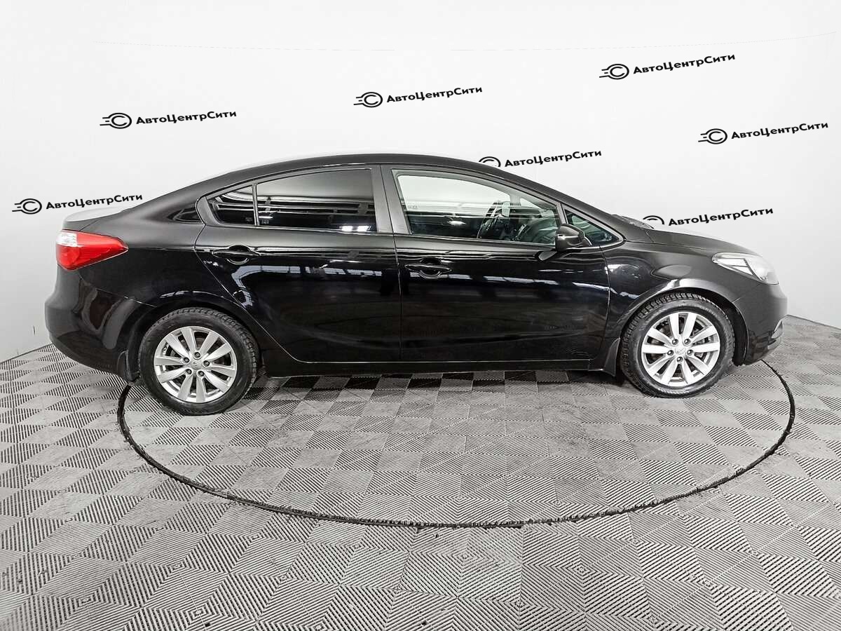 Kia Cerato с пробегом — 2013 год. Фото: #3