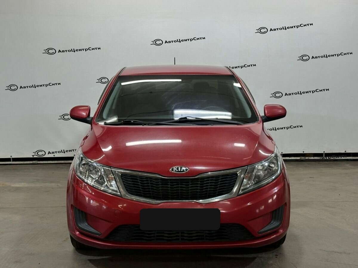 Kia Rio с пробегом — 2013 год. Фото: #1