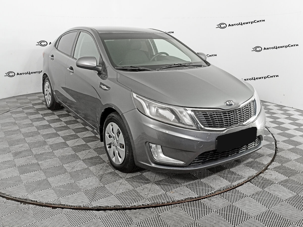 Kia Rio с пробегом — 2013 год. Фото: #1