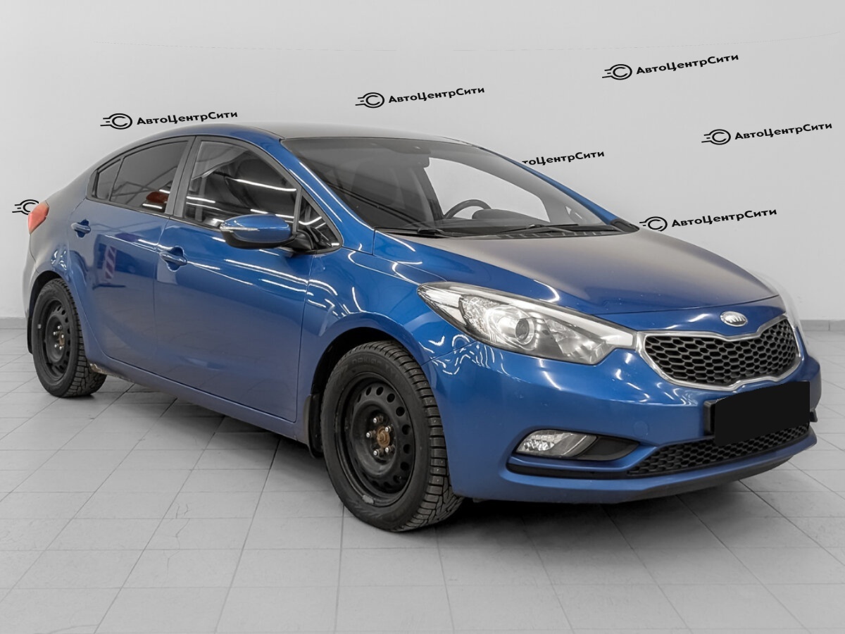 Kia Cerato с пробегом — 2013 год. Фото: #2