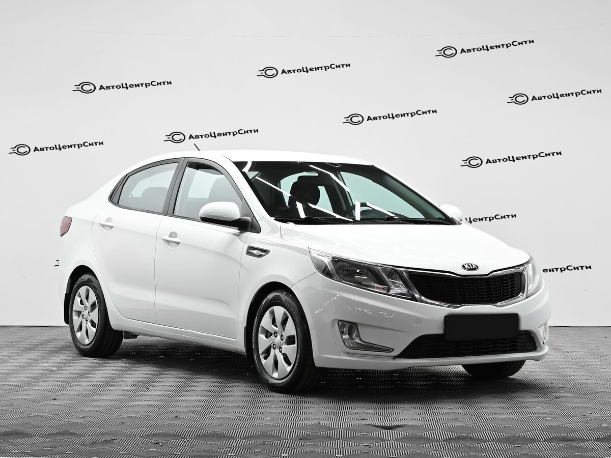 Kia Rio с пробегом — 2013 год. Фото: #1