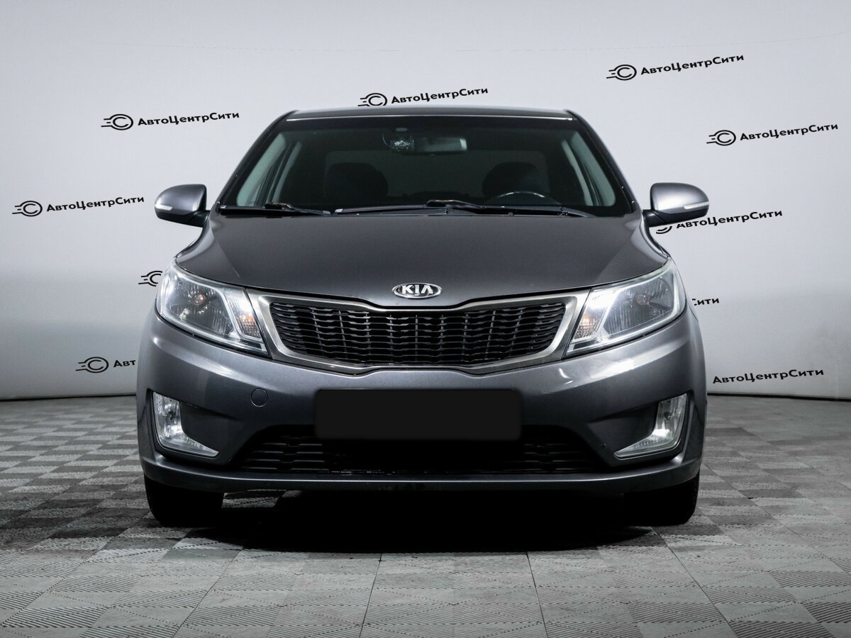 Kia Rio с пробегом — 2013 год. Фото: #1
